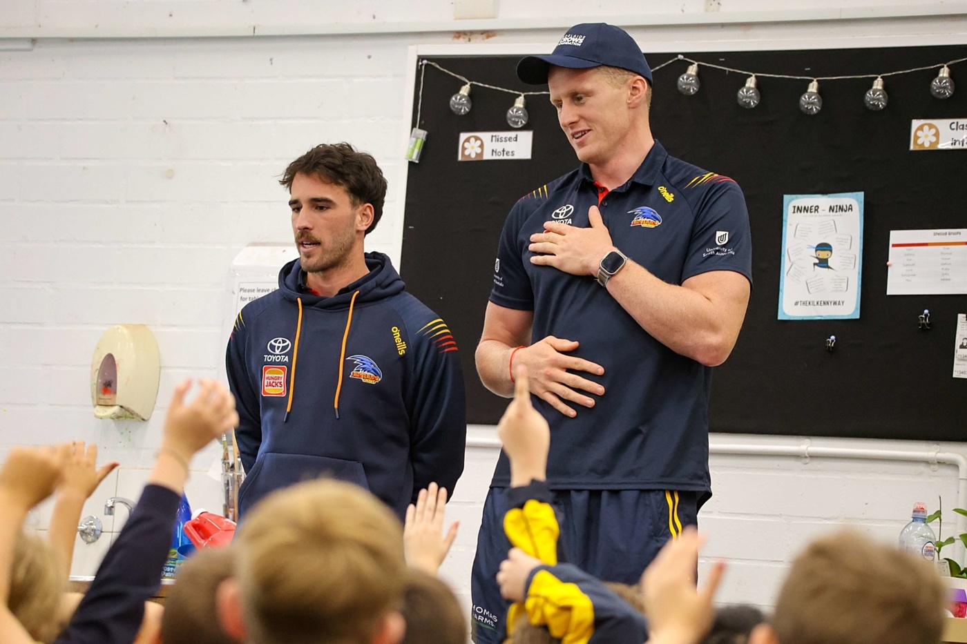 Crows ruckman Reilly O Brien in the classroom speading the word on mental health