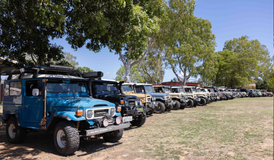 Driven by purpose, a mob of Landcruisers hits the road