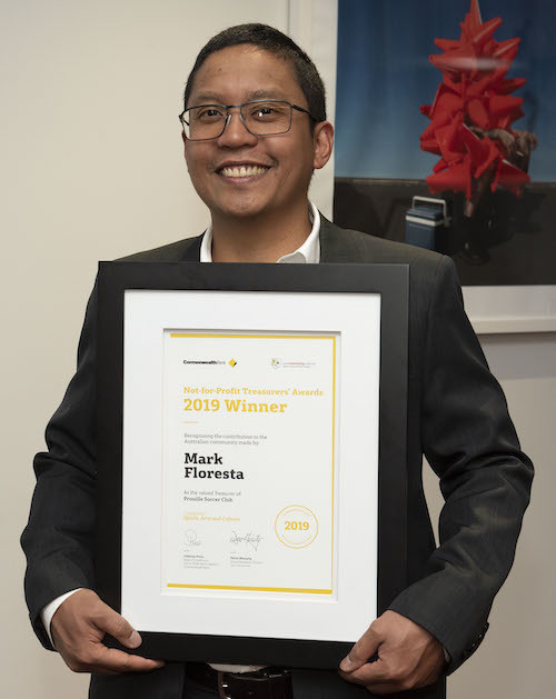 Mark Floresta with his award certificate.