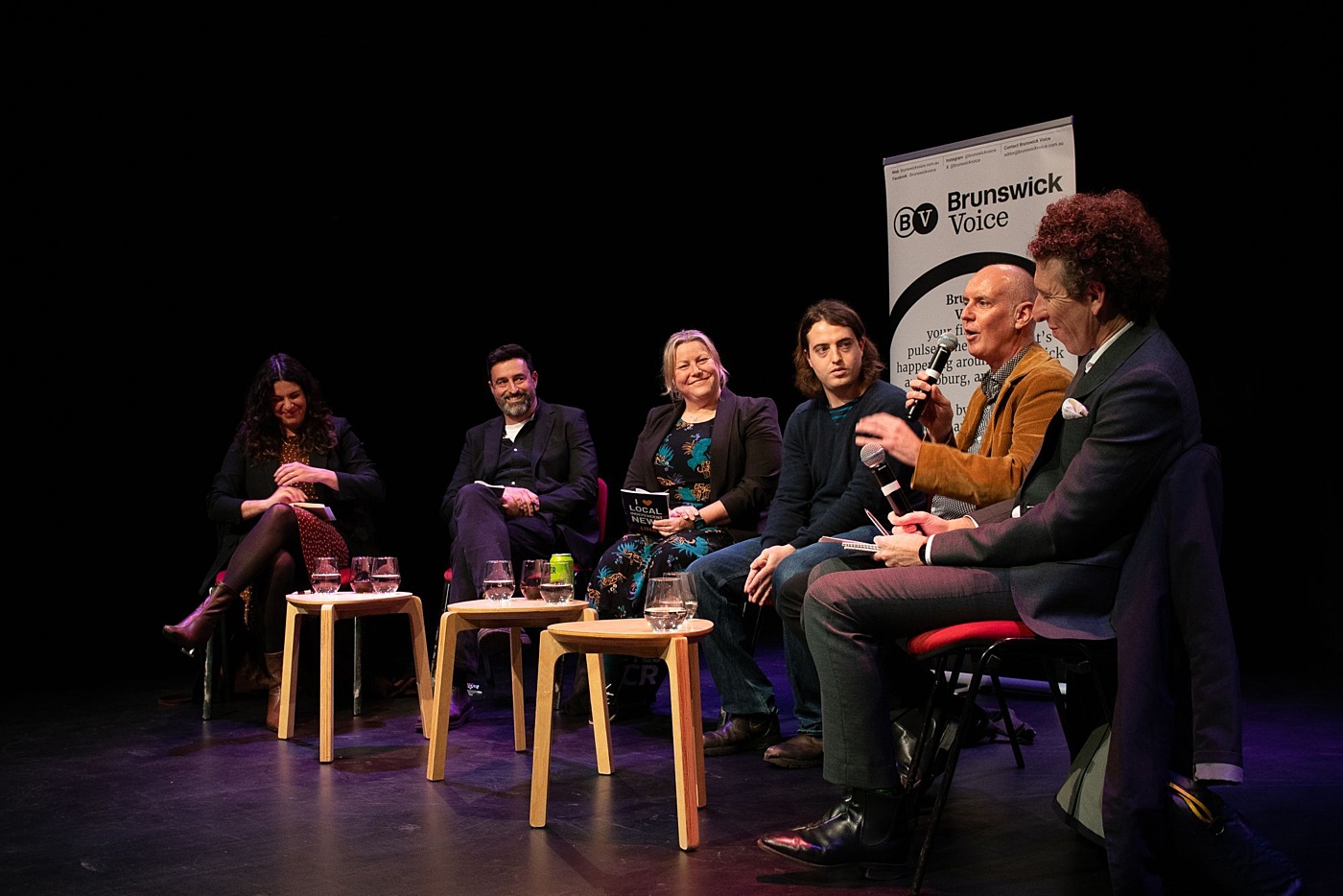 Brunswick Voice editor Mark Phillips makes a point during the panel discussion on the value of local news