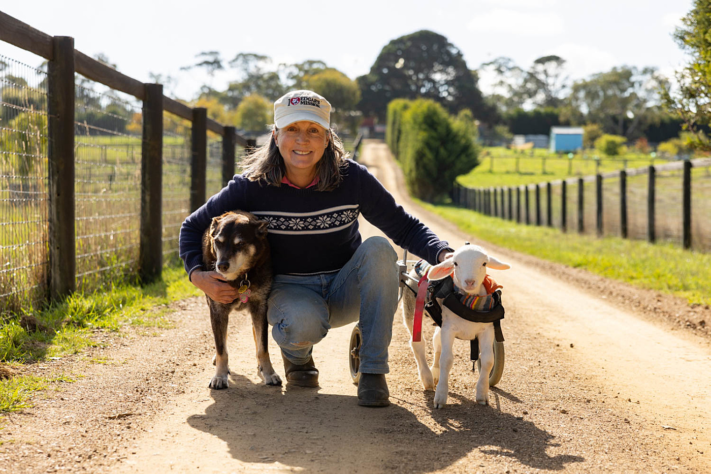 Edgars Mission Founder Pam Ahern with Kansas and Ruby the kelpie