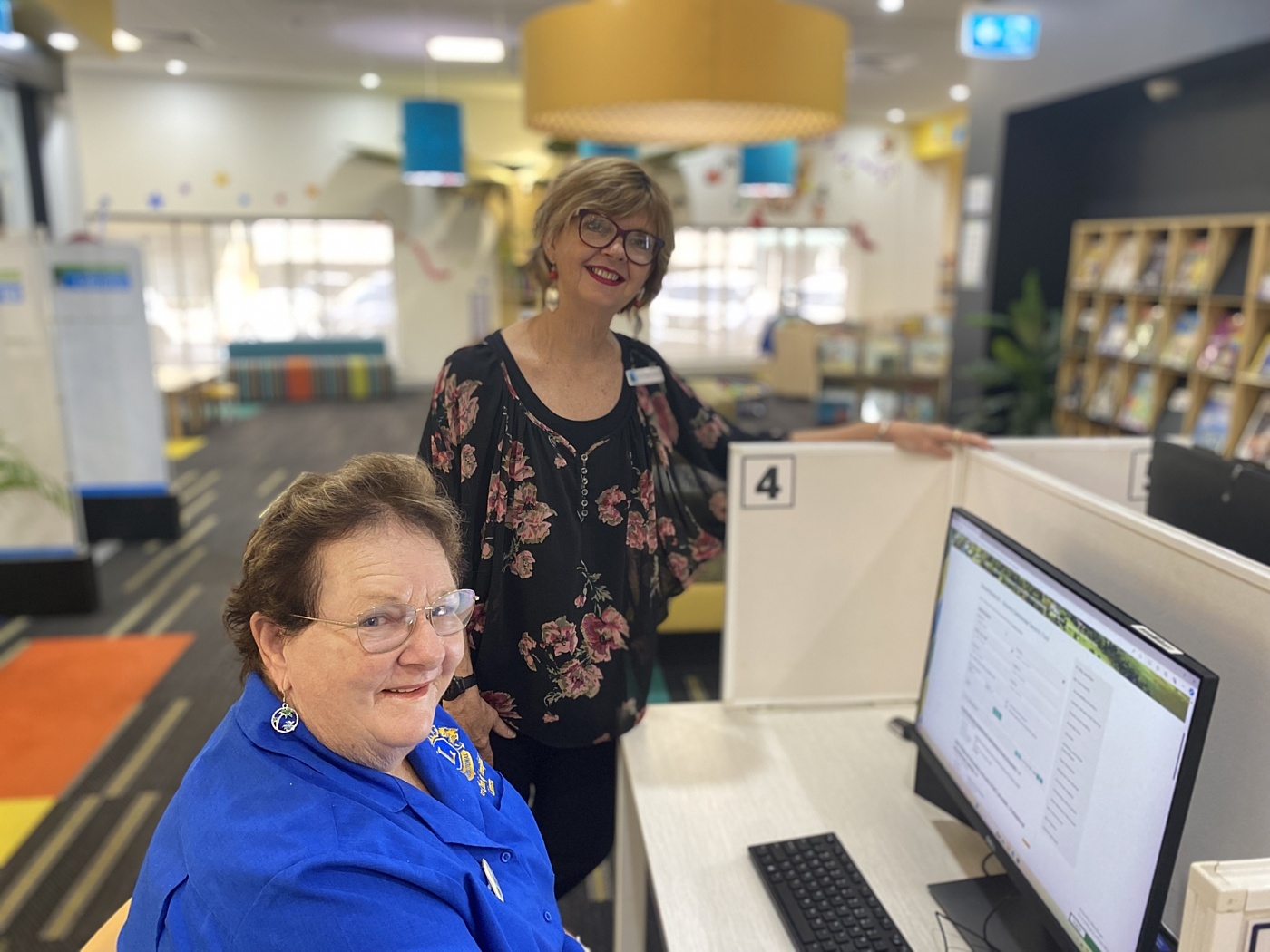 Heather Westcott Lioness Lions Club Innisfail search for grants with Councillor Trudy Tschui at Innisfail Library